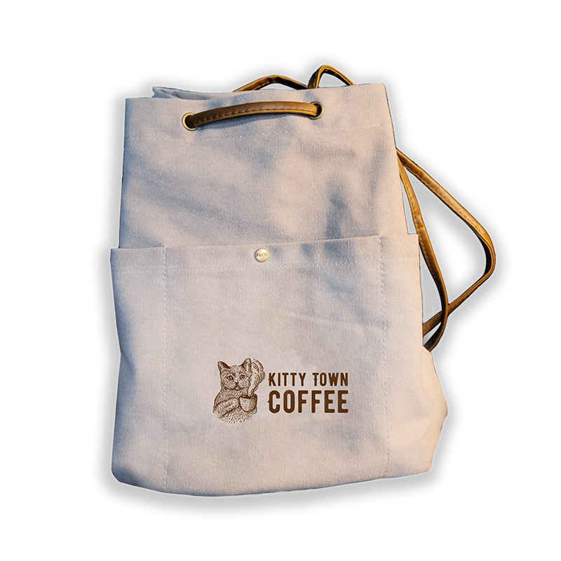 http://www.kittytowncoffee.com/cdn/shop/products/SlingBackPack.png?v=1672114115